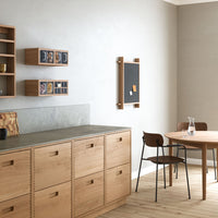 Modern wood furniture in natural tones with gray accents, featuring a minimalist design and earthy textures.