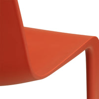 Vibrant orange chair with a sleek, modern design and smooth, curved lines. Perfect for contemporary spaces.