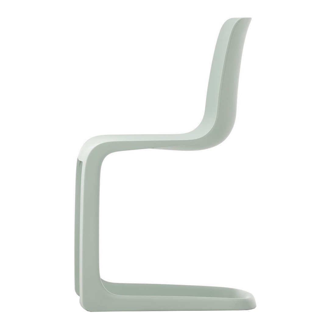 Light mint green chair with a sleek, minimalist design and smooth, curved lines. Perfect for modern decor.