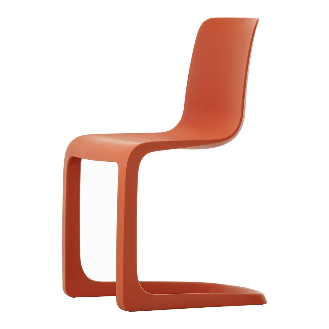 Orange molded chair with a sleek design and smooth, curved lines. Perfect for modern indoor spaces.