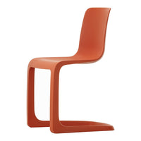 Orange molded chair with a sleek design and smooth, curved lines. Perfect for modern indoor spaces.