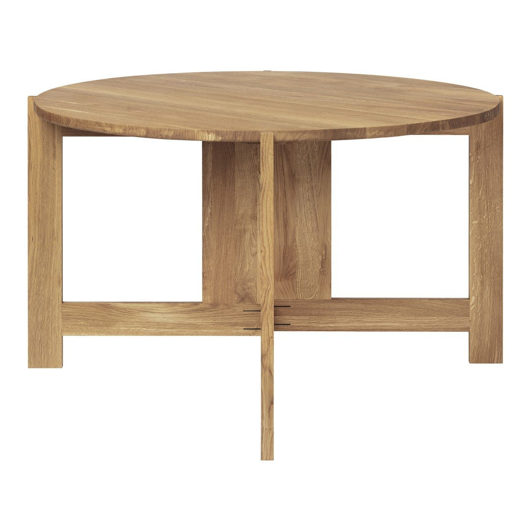 Round wooden coffee table featuring a natural wood finish, with a smooth surface and minimalist design.