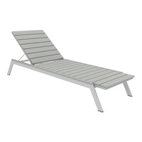 Gray slatted lounge chair with a modern design, featuring sleek lines and a minimalist aesthetic.