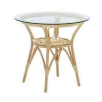 Round rattan table with natural bamboo finish and clear glass top, featuring a woven pattern on the base.