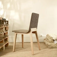 "Minimalist chair featuring a taupe seat and a grey fabric back, complemented by light wood legs and a natural texture."