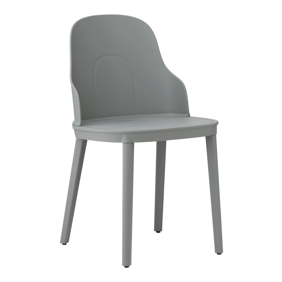 Gray plastic chair with a smooth finish and minimalist design, featuring a contemporary and soft silhouette.