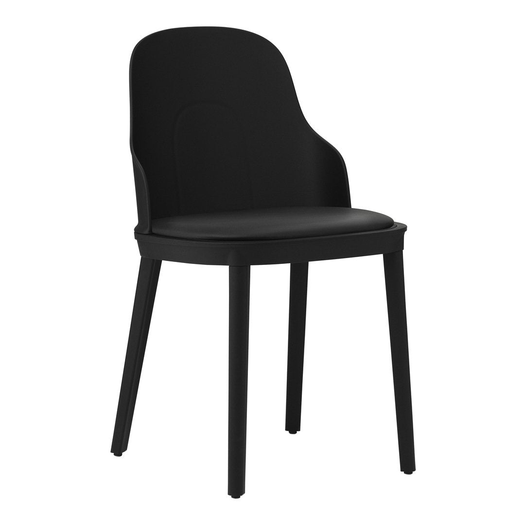 Sleek black chair with a smooth, minimalist design and curved backrest, perfect for modern decor.