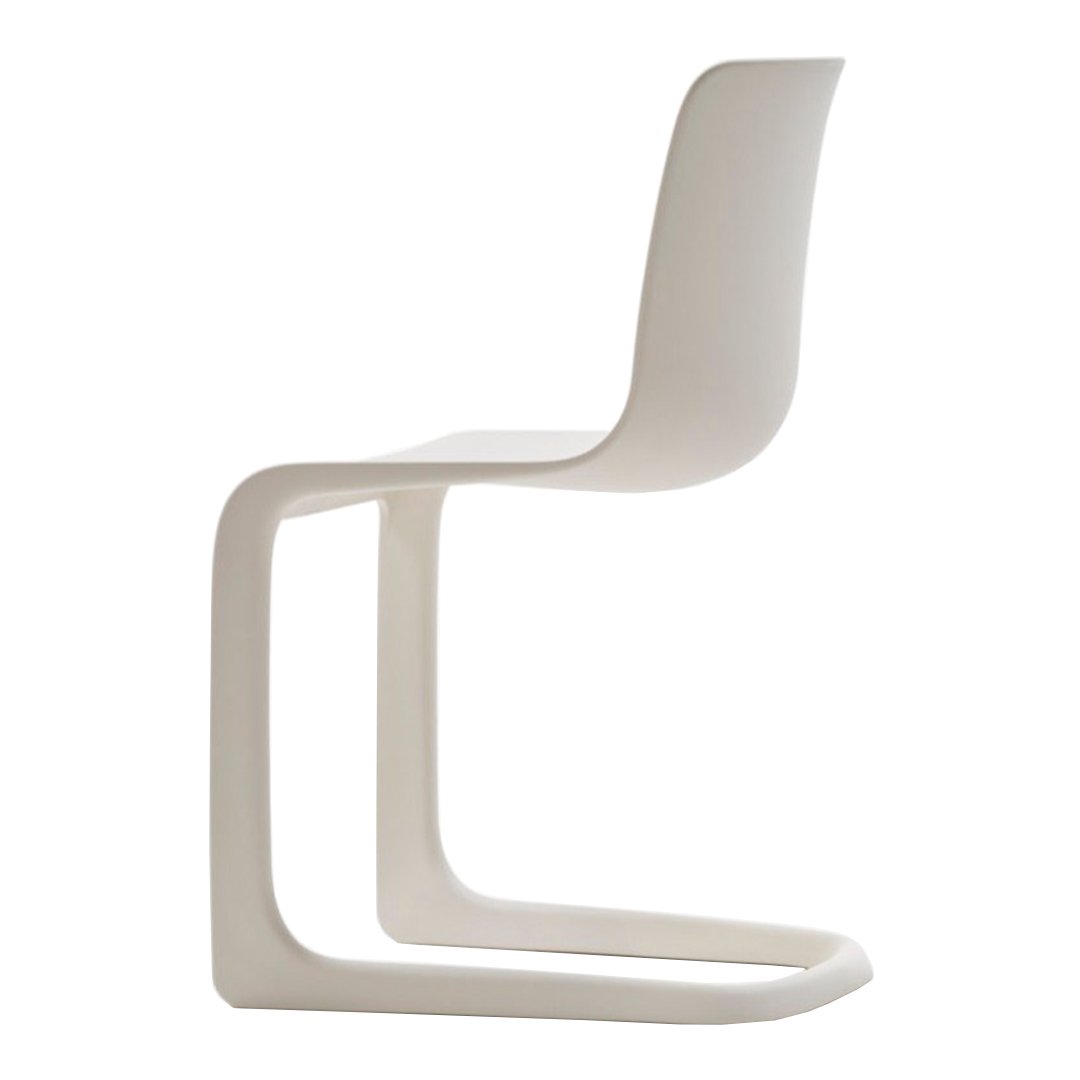 Sleek white minimalist chair with a smooth, curved design and no visible patterns.