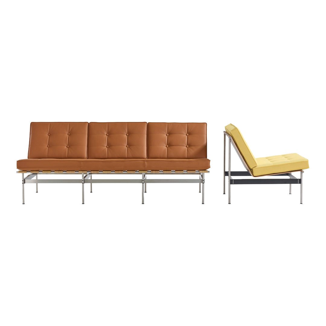 Brown leather sofa with tufted design and sleek metal frame; modern yellow accent chair.