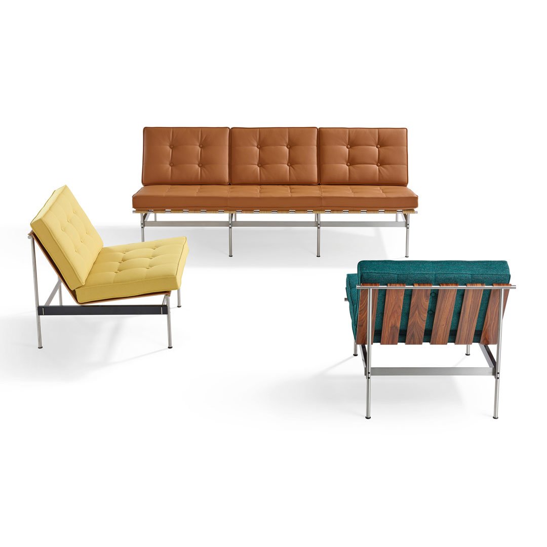 Stylish seating set featuring a brown tufted sofa, yellow couch, and teal accent chair with sleek metallic frames.