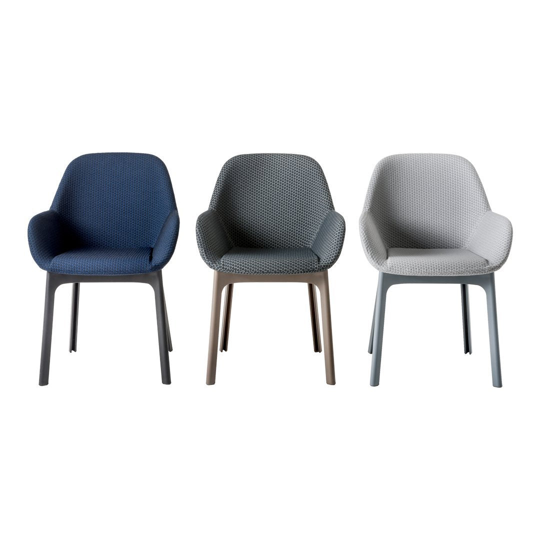 Set of three stylish chairs in navy blue, gray, and light gray upholstery with sleek, modern frames.
