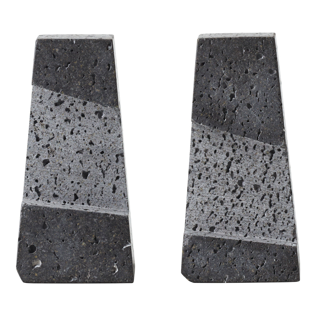"Gray and black geometric stone bookends with subtle speckled patterns and polished finishes."