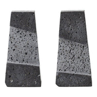 "Gray and black geometric stone bookends with subtle speckled patterns and polished finishes."