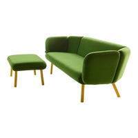 Green velvet sofa with matching ottoman, featuring smooth surfaces and rounded shapes for a modern look.