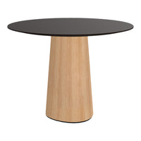 Round table with a black top and a light wood base, featuring a smooth, modern design. Ideal for contemporary decor.