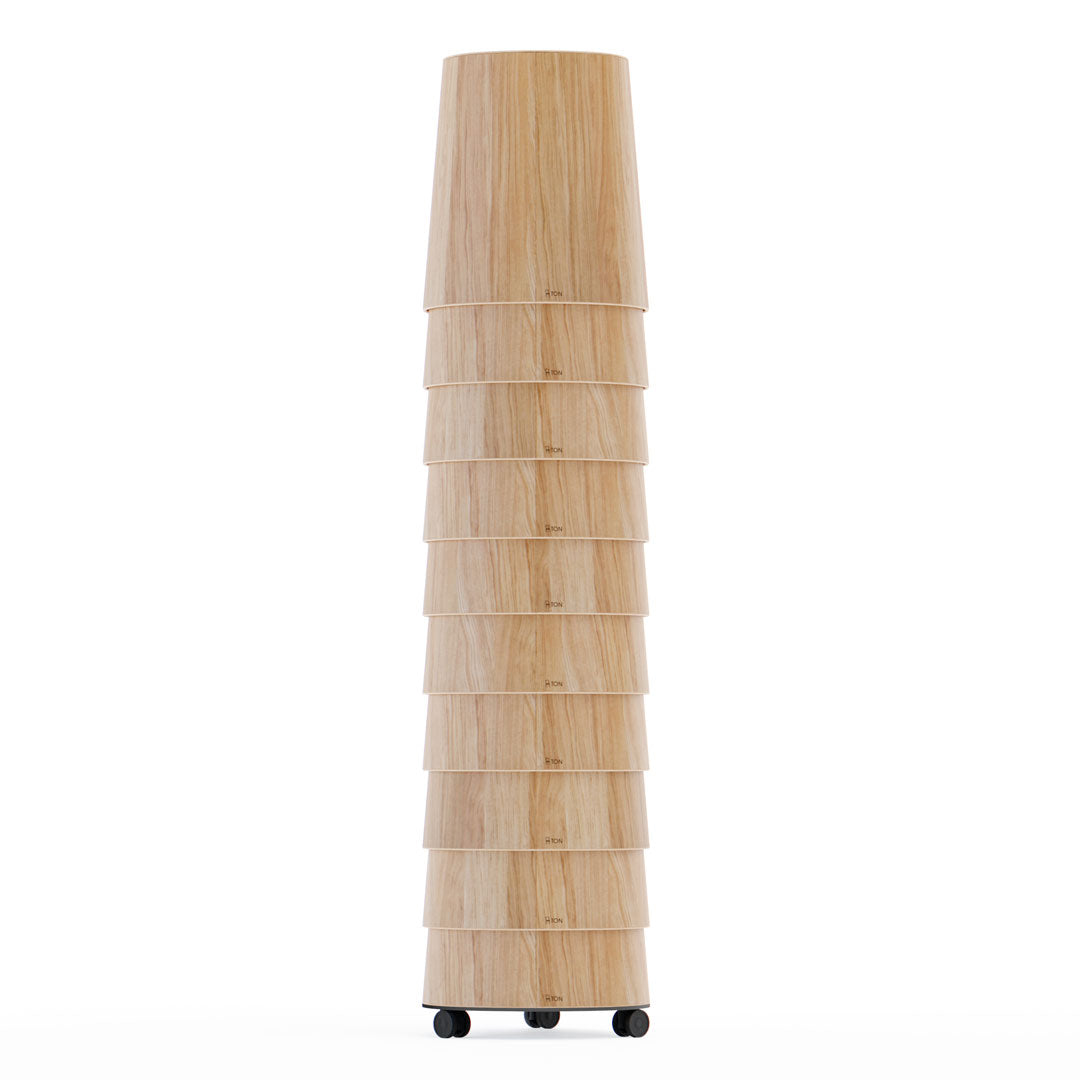 Wooden floor lamp with a light natural finish and stacked, layered design, enhancing modern decor aesthetics.
