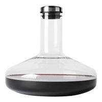 Clear glass decanter with a sleek black base and stainless steel lid, featuring smooth curves and elegant design.