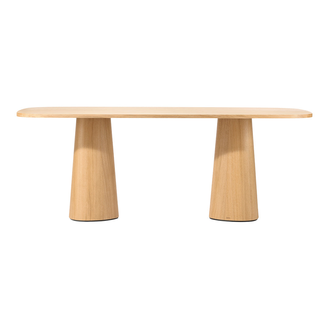 Light wood dining table with a smooth, natural finish and soft, curved edges, showcasing a minimalist design.