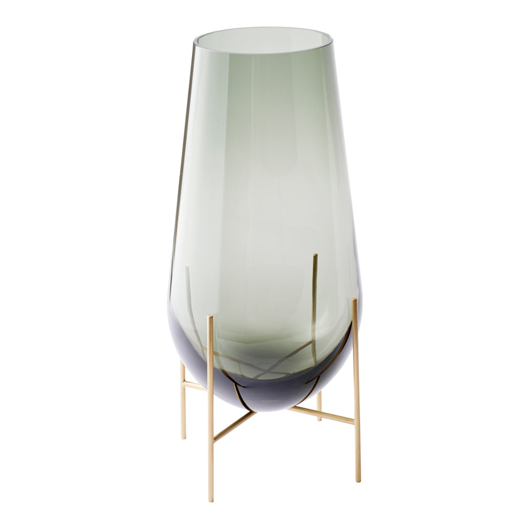 Green and gradient glass vase with sleek gold metal stand, featuring a modern, minimalist design.