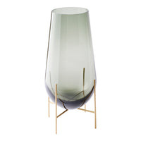 Green and gradient glass vase with sleek gold metal stand, featuring a modern, minimalist design.