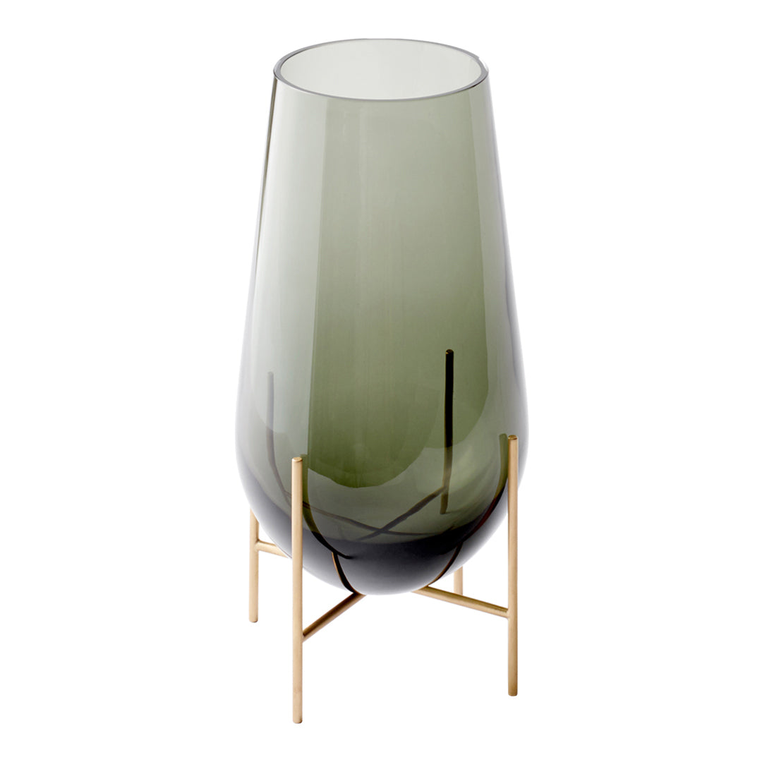 Green-tinted glass vase with a sleek gold stand, featuring a modern and elegant design.