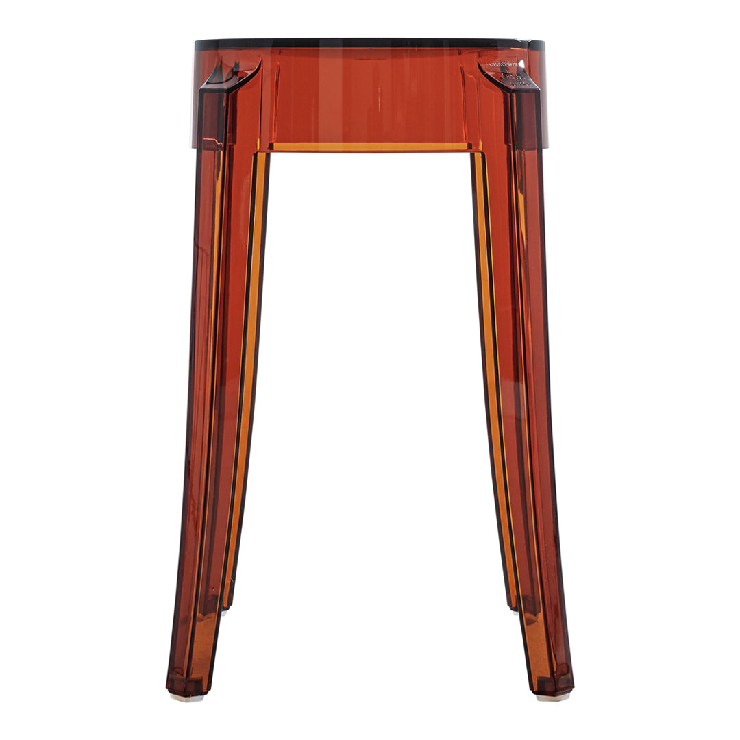 Amber transparent accent table with sleek, modern lines and subtle angular patterns. Ideal for contemporary decor.