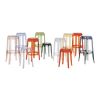 Colorful transparent stools in orange, green, blue, and purple with sleek modern design and clear legs.