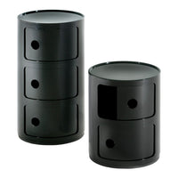 Black cylindrical storage units with smooth surfaces and circular patterns, featuring three and two drawers.