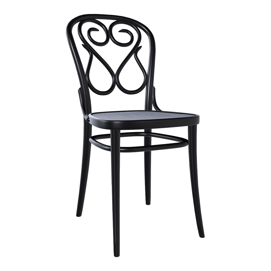 Black bentwood chair with an intricate scroll pattern on the backrest, featuring a sleek design and minimalist aesthetic.