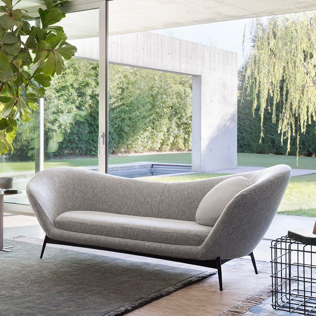 Stylish gray sofa with a textured pattern, featuring a sleek design and black legs, perfect for modern decor.