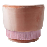 Pink velvet round ottoman with soft gradient and playful pink fringe detailing at the base. Elegant and stylish design.