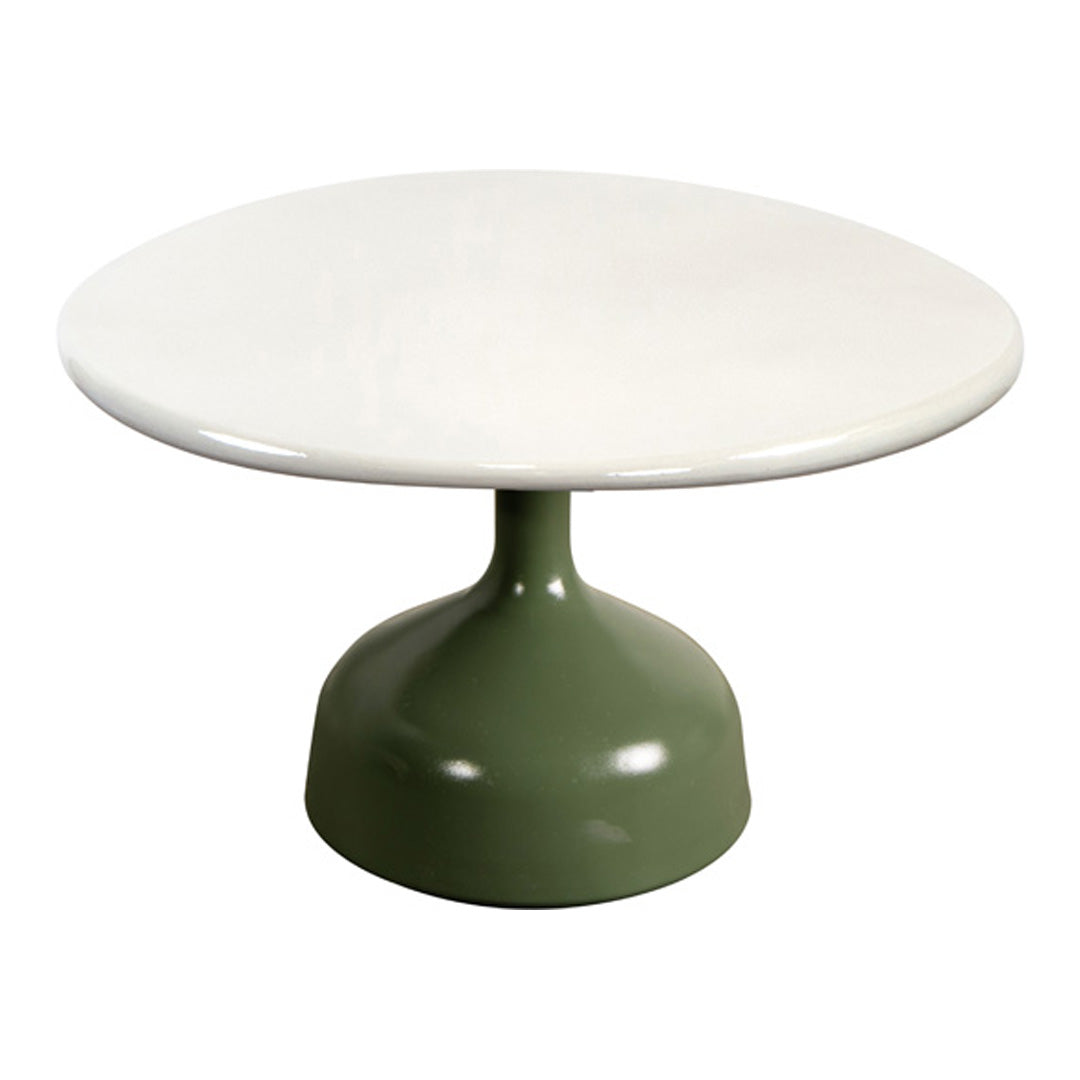 Round white tabletop with a sleek, green pedestal base, featuring a minimalist design and smooth finish.