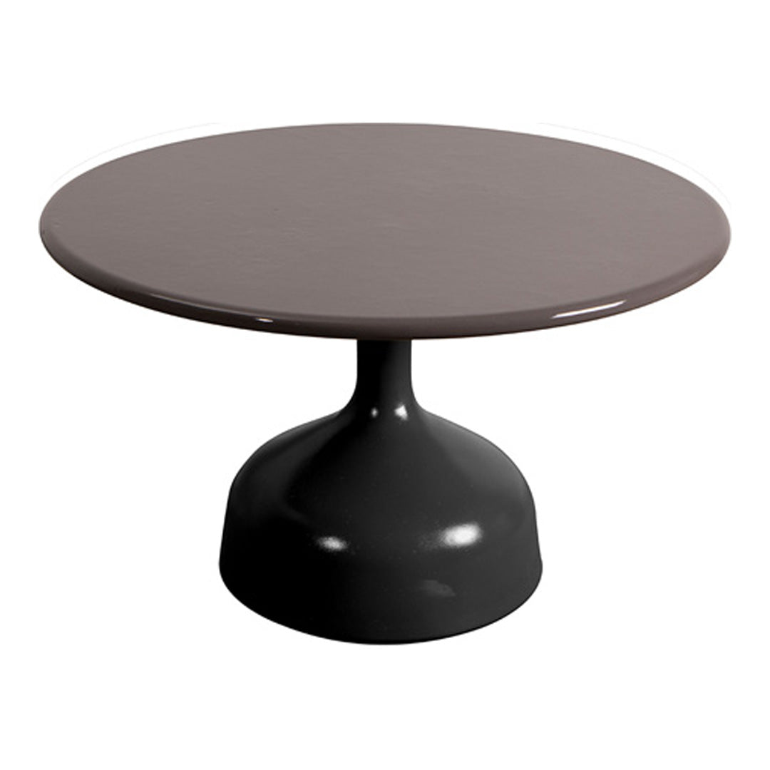 Round table with a smooth, muted brown top and a sleek black base, showcasing a modern and minimalist design.
