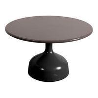 Round table with a smooth, muted brown top and a sleek black base, showcasing a modern and minimalist design.