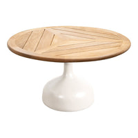 Round wooden table with a natural wood finish and white pedestal base, featuring a herringbone pattern on the top.