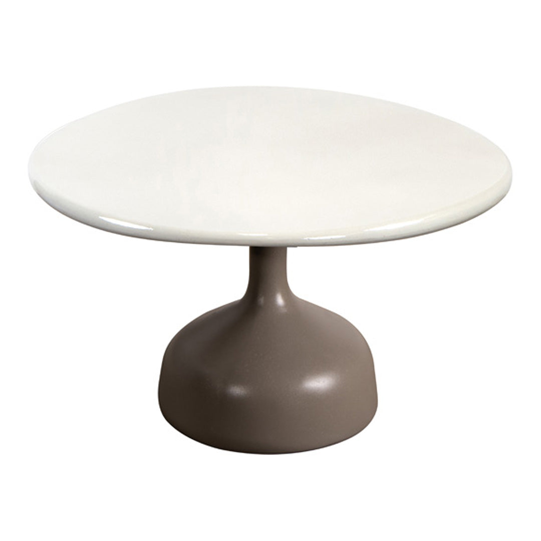 Round table featuring a smooth white top and a modern taupe base, creating a sleek, contemporary look.