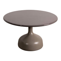 Round taupe dining table with a smooth, glossy finish and a modern pedestal base, perfect for contemporary spaces.