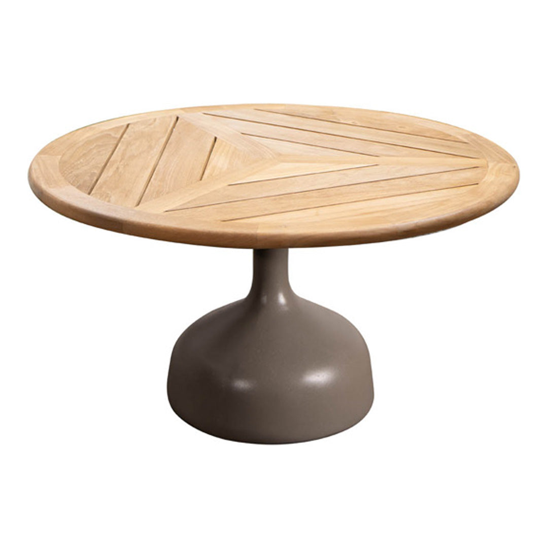 Round coffee table with a natural wood top featuring a geometric pattern, set on a sleek gray pedestal base.