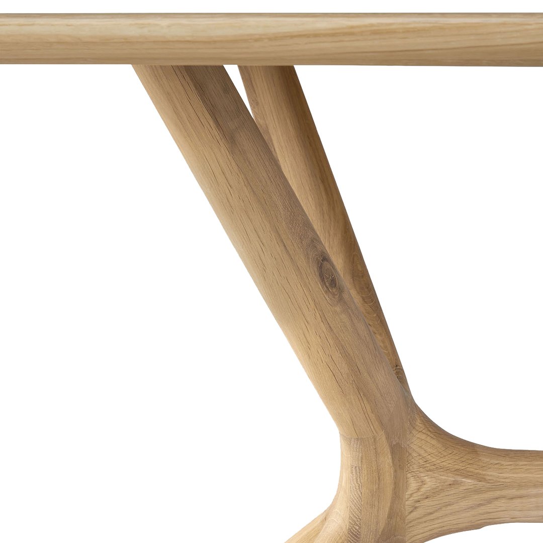 Natural oak wood table leg with a smooth, light finish and organic, flowing design.