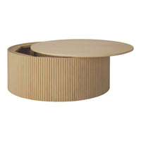 Light wooden coffee table with round top and vertical ribbed pattern. Natural finish complements modern decor.