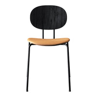Black chair with a smooth oval back and a warm tan seat, featuring minimalist design and sleek metal legs.