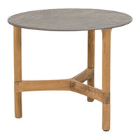 Round table with a smooth grey top and natural wood legs featuring a simple, modern design. 