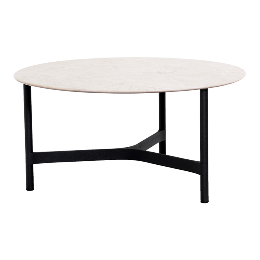 Round coffee table with a smooth white marble top and sleek black metal legs. Modern, minimalist design perfect for any decor.