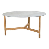 Round gray tabletop with a smooth surface and natural wood legs, featuring a minimalist design.