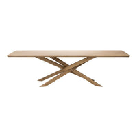 "Natural wood dining table with a smooth surface and intersecting cross-leg design."