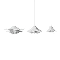 White hanging lamps with layered petal-like patterns, creating a sleek and modern aesthetic.