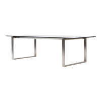 Sleek silver metal frame with a smooth, glossy tabletop in a minimalist design, perfect for modern interiors.