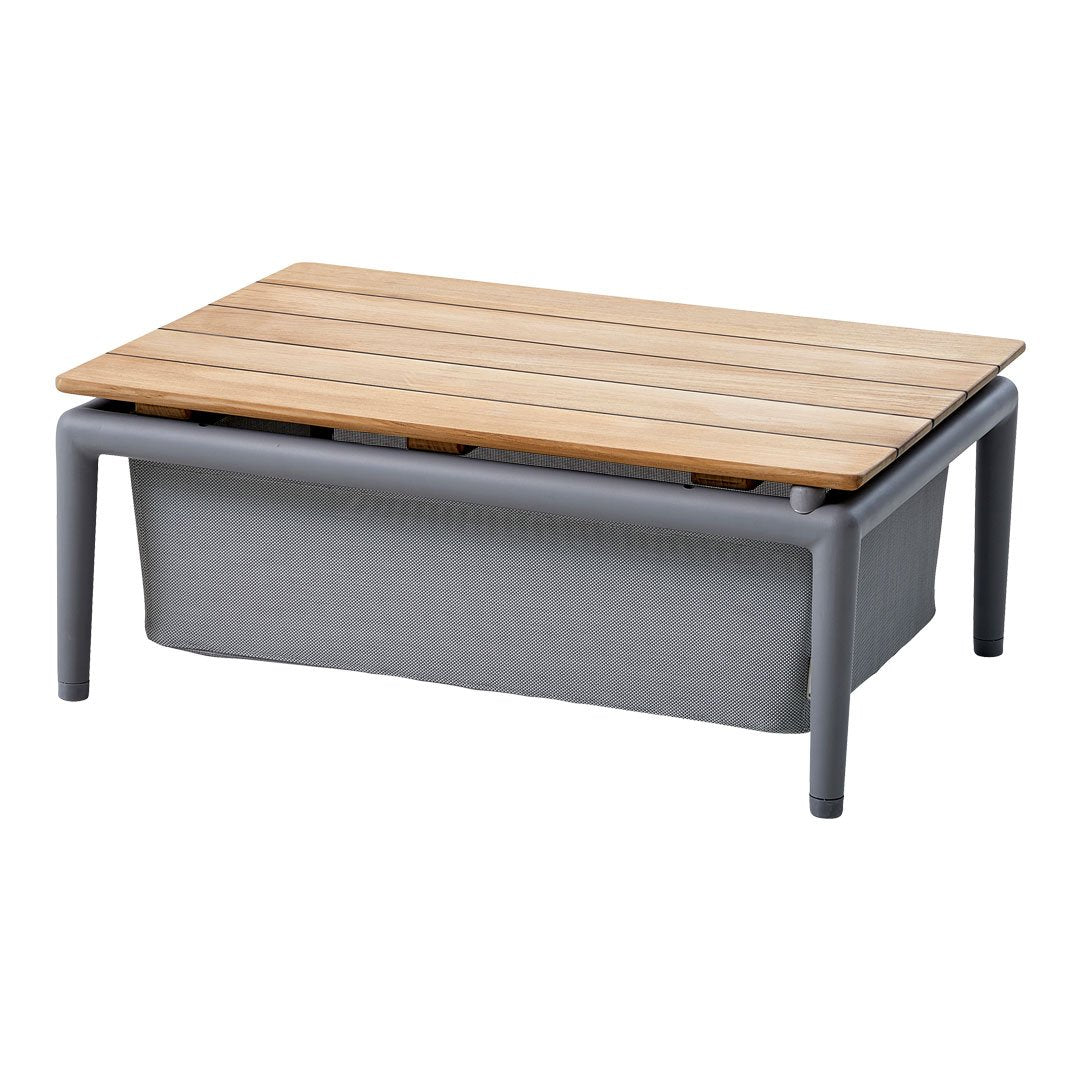 Rectangular coffee table featuring a natural wood top and gray fabric base, designed with a sleek, modern aesthetic.