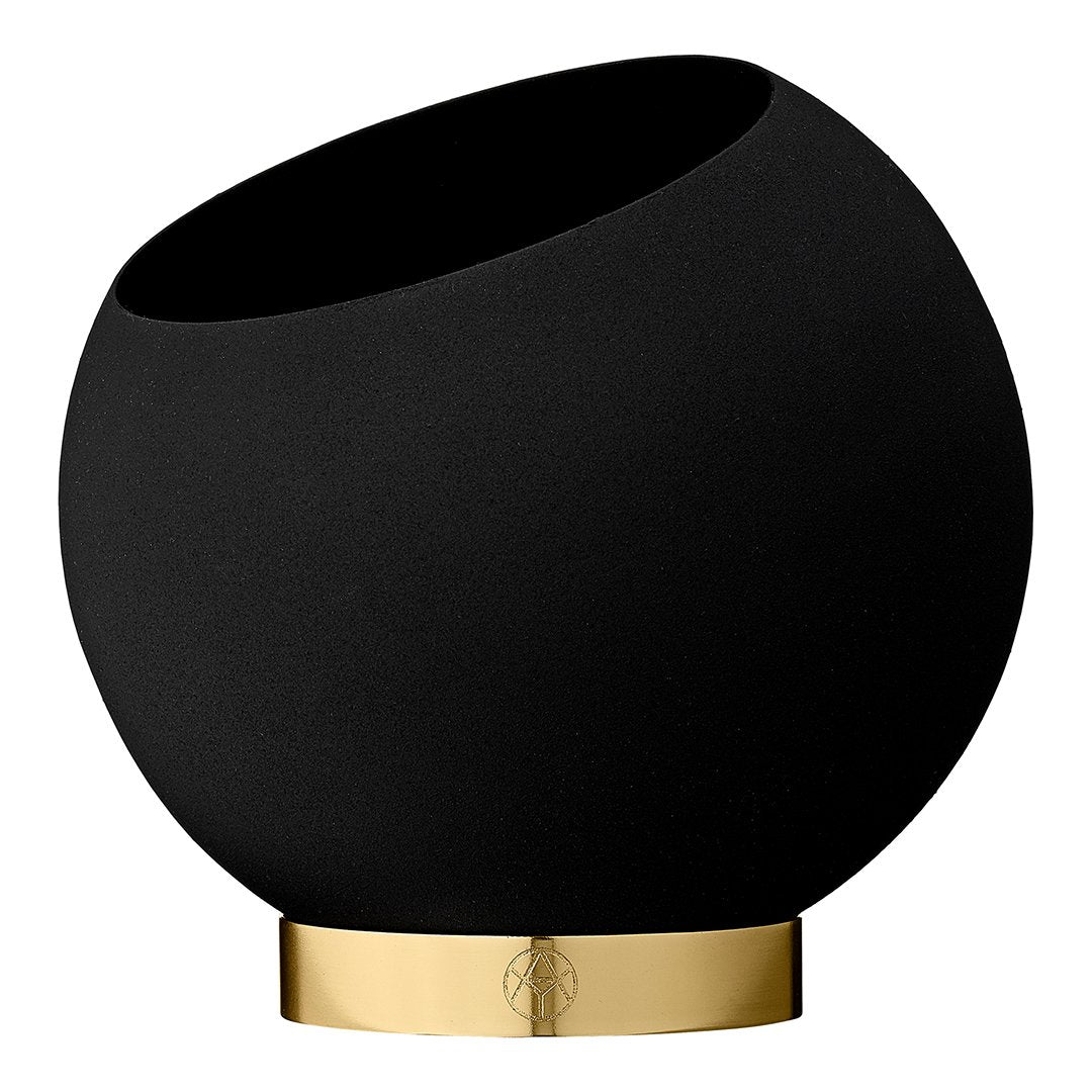 Black ceramic bowl with a sleek gold base, featuring a modern, minimalist design.