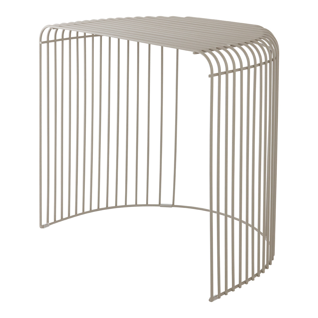 Stylish curved beige metal side table with a sleek vertical line pattern. Perfect for modern decor.